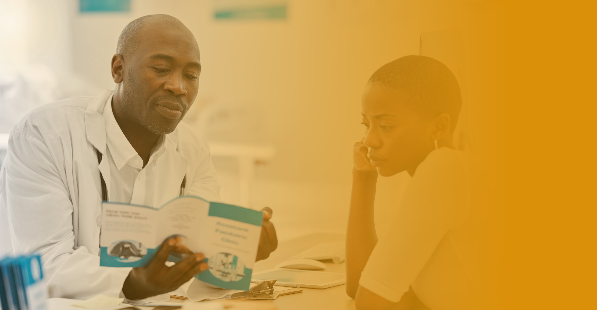 Doctor showing a patient a brochure to highlight the importance of healthcare brand management.