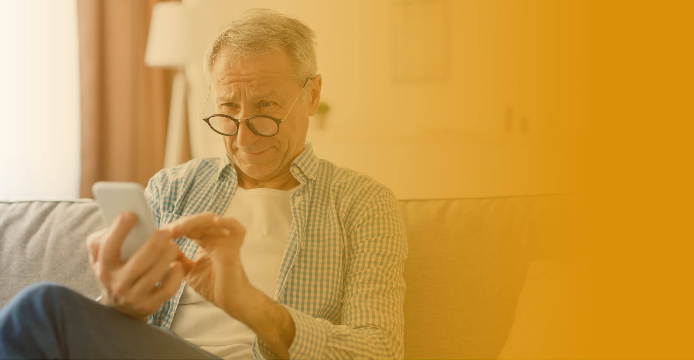 healthcare web accessibility. Elderly man squinting at phone